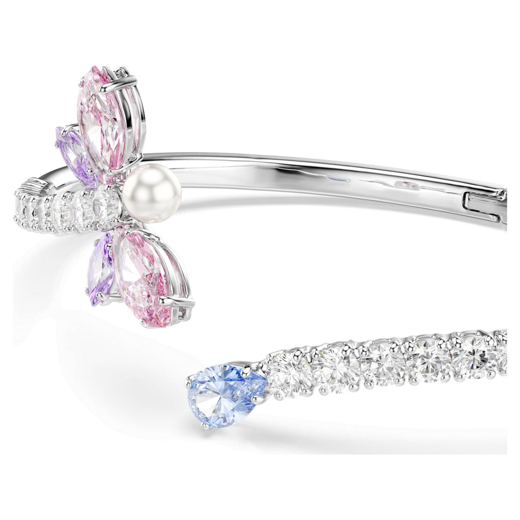 Ariana Grande x Swarovski bangle featuring a dragonfly motif with multicolored mixed-cut accents and rhodium plating