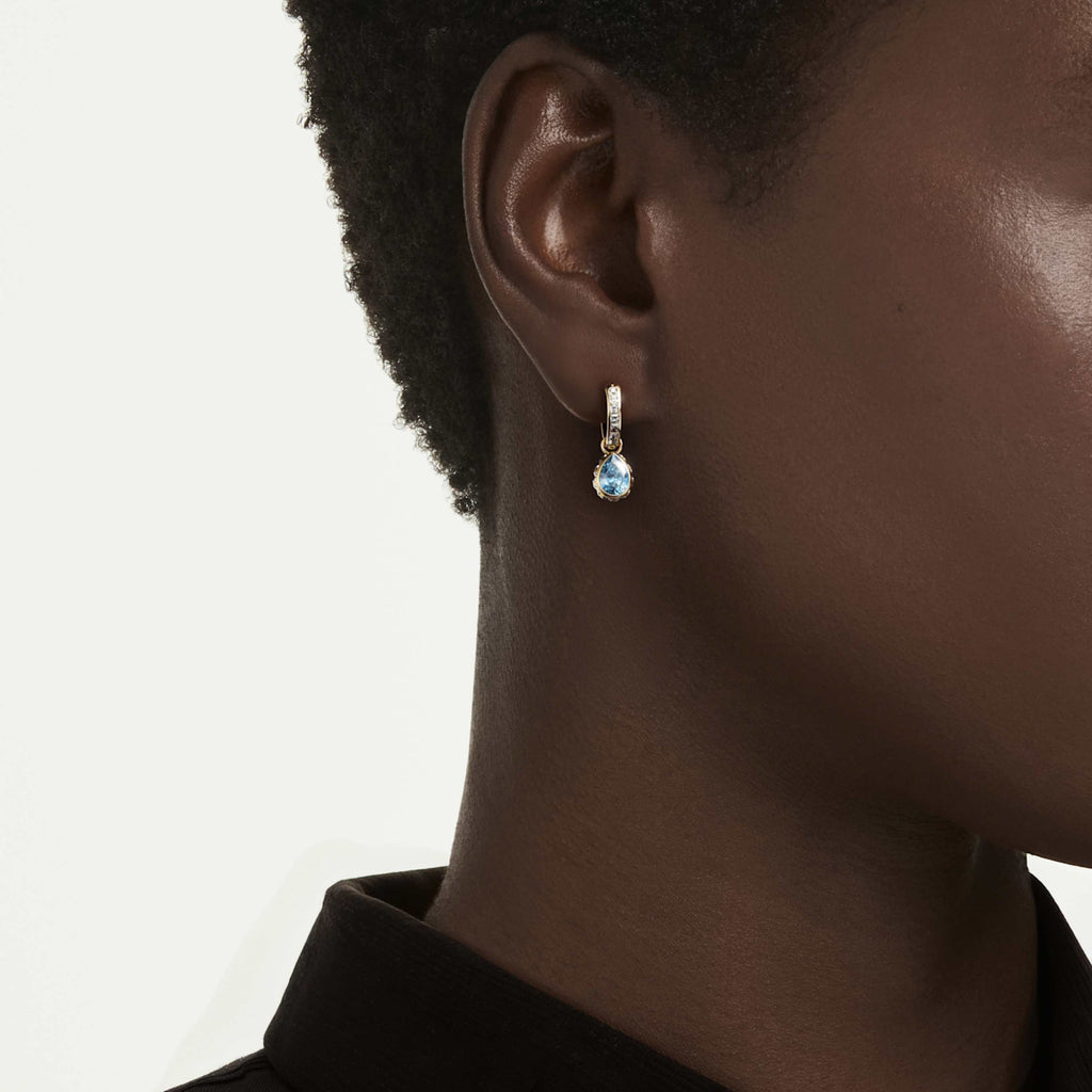 Swarovski Chroma drop earrings with green pear-cut accents and an 18K gold finish