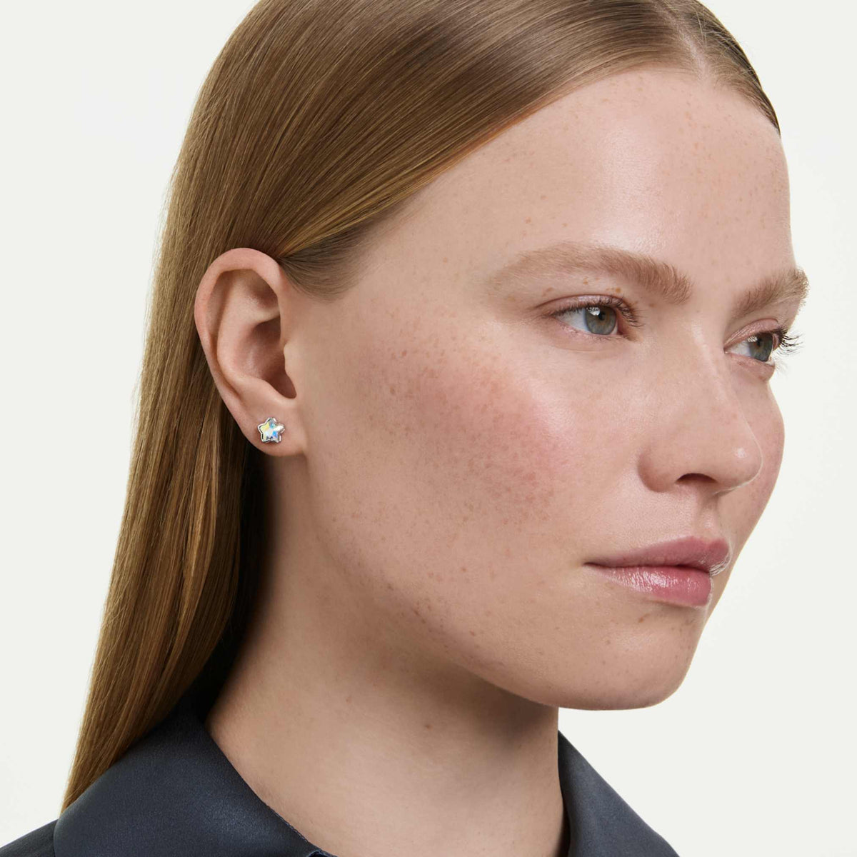 Swarovski Chroma earrings featuring a star motif with white mixed-cut accents and rhodium plating