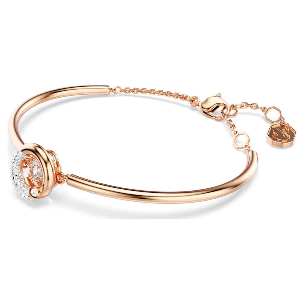 Swarovski Dextera bangle with white round-cut accents and an 18K rose gold finish