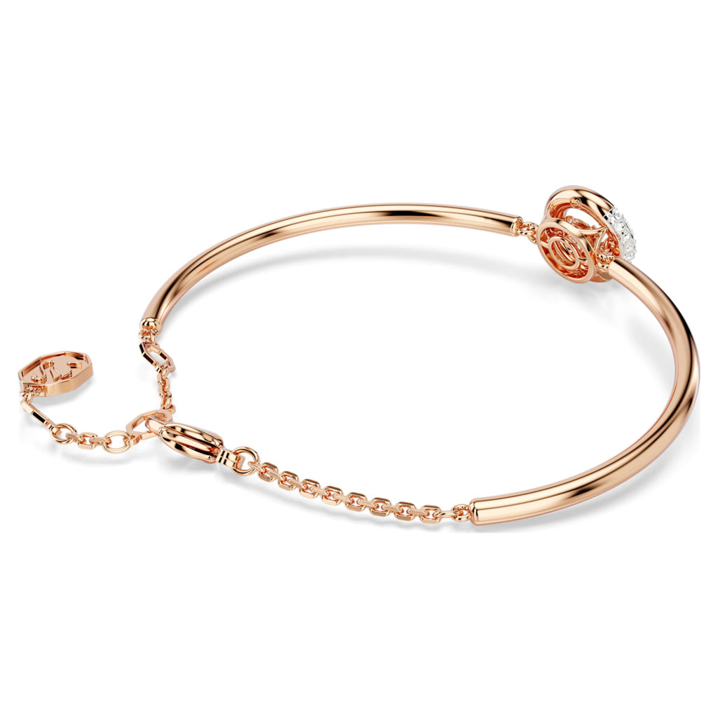 Swarovski Dextera bangle with white round-cut accents and an 18K rose gold finish