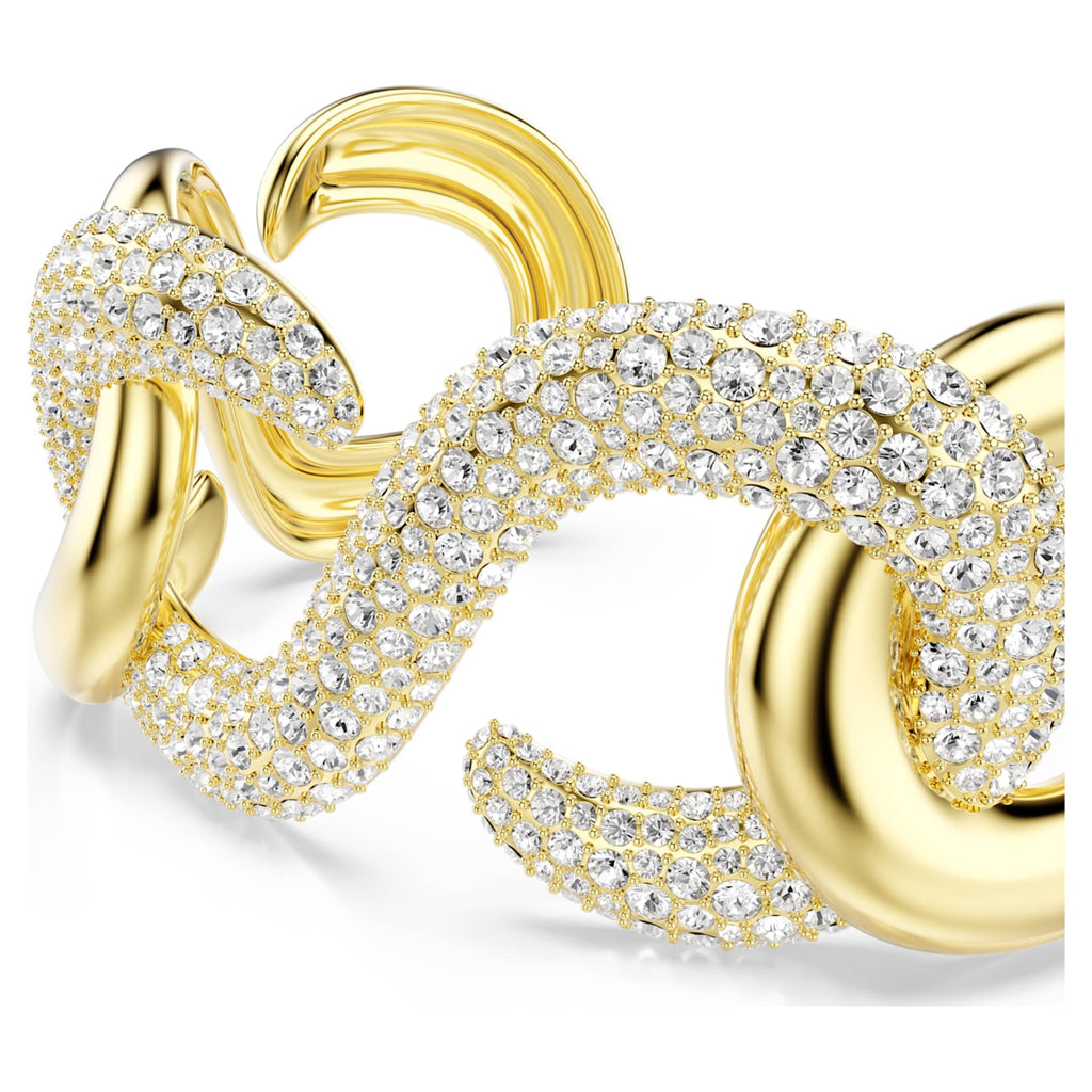 Swarovski Dextera cuff with white round-cut accents and an 18K gold finish