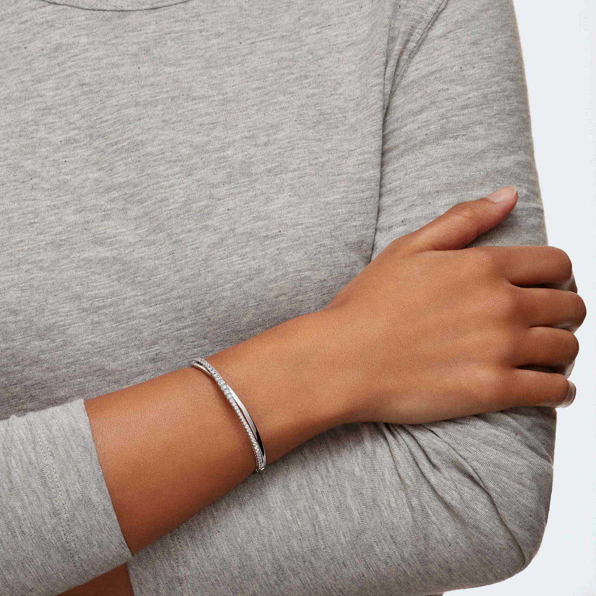 Swarovski Hyperbola bangle with white accents and an 18K rose gold finish