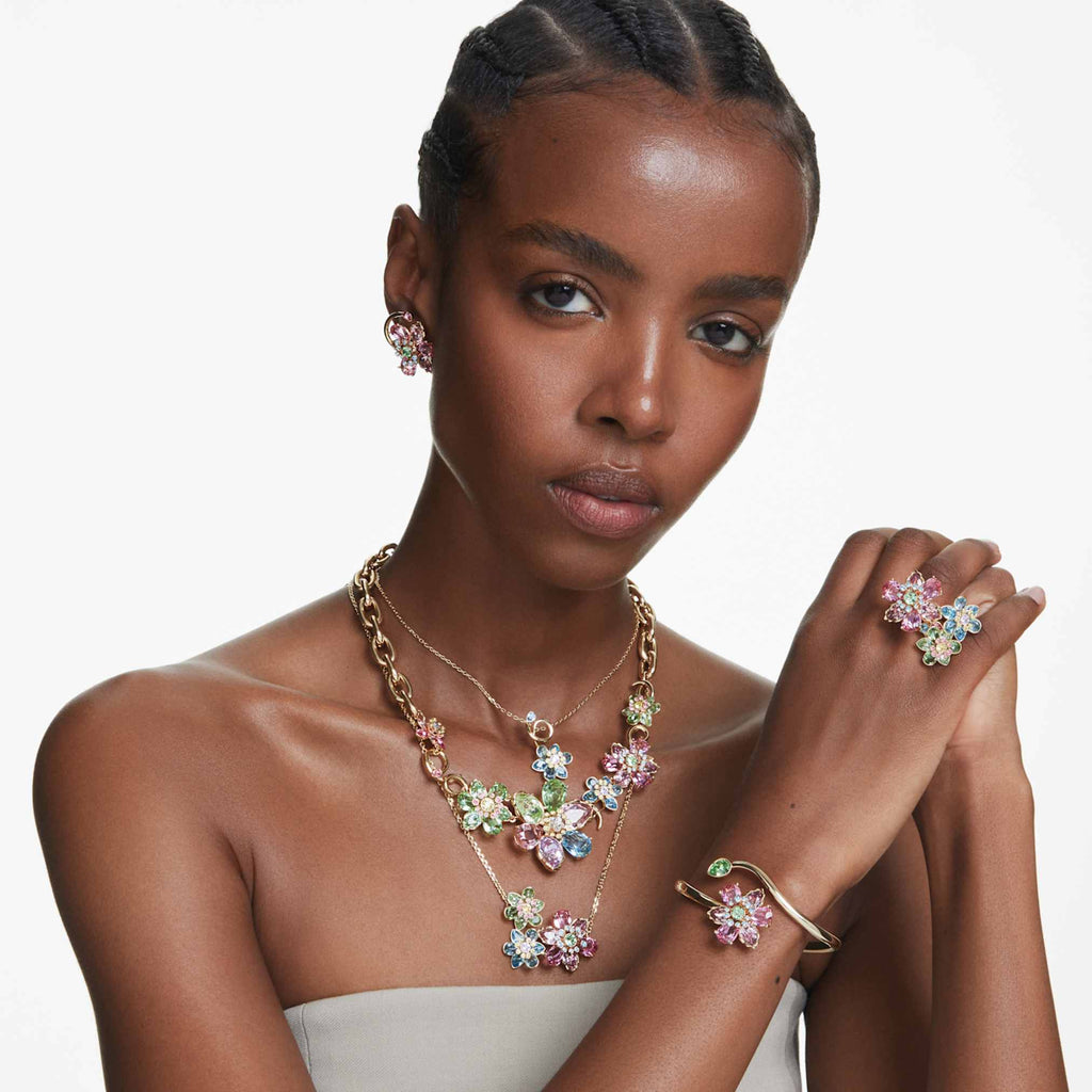 Swarovski Idyllia ring featuring a flower motif with multicolored mixed-cut accents and an 18K gold finish