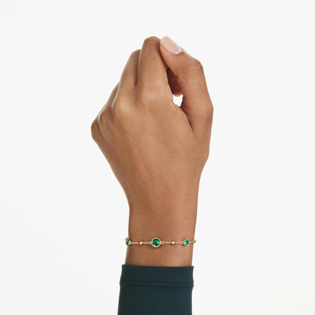 Swarovski Imber bracelet with green round-cut accents and an 18K gold finish