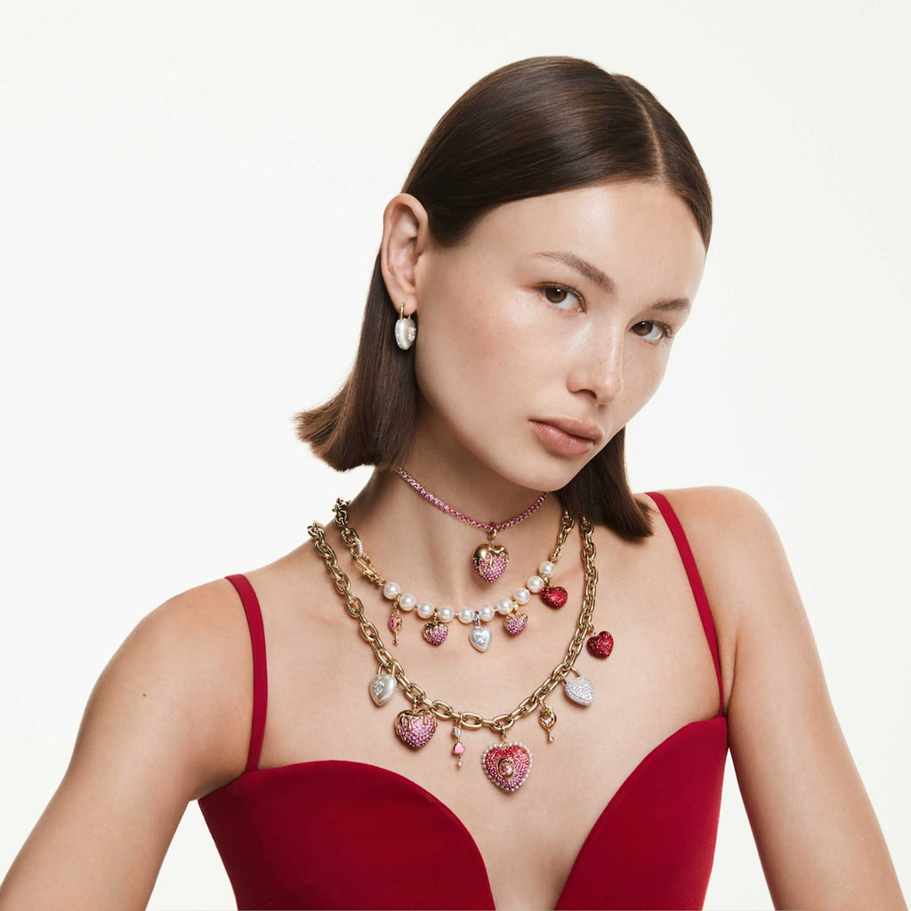 Swarovski Matrix Tennis necklace with pink round-cut accents and an 18K gold finish