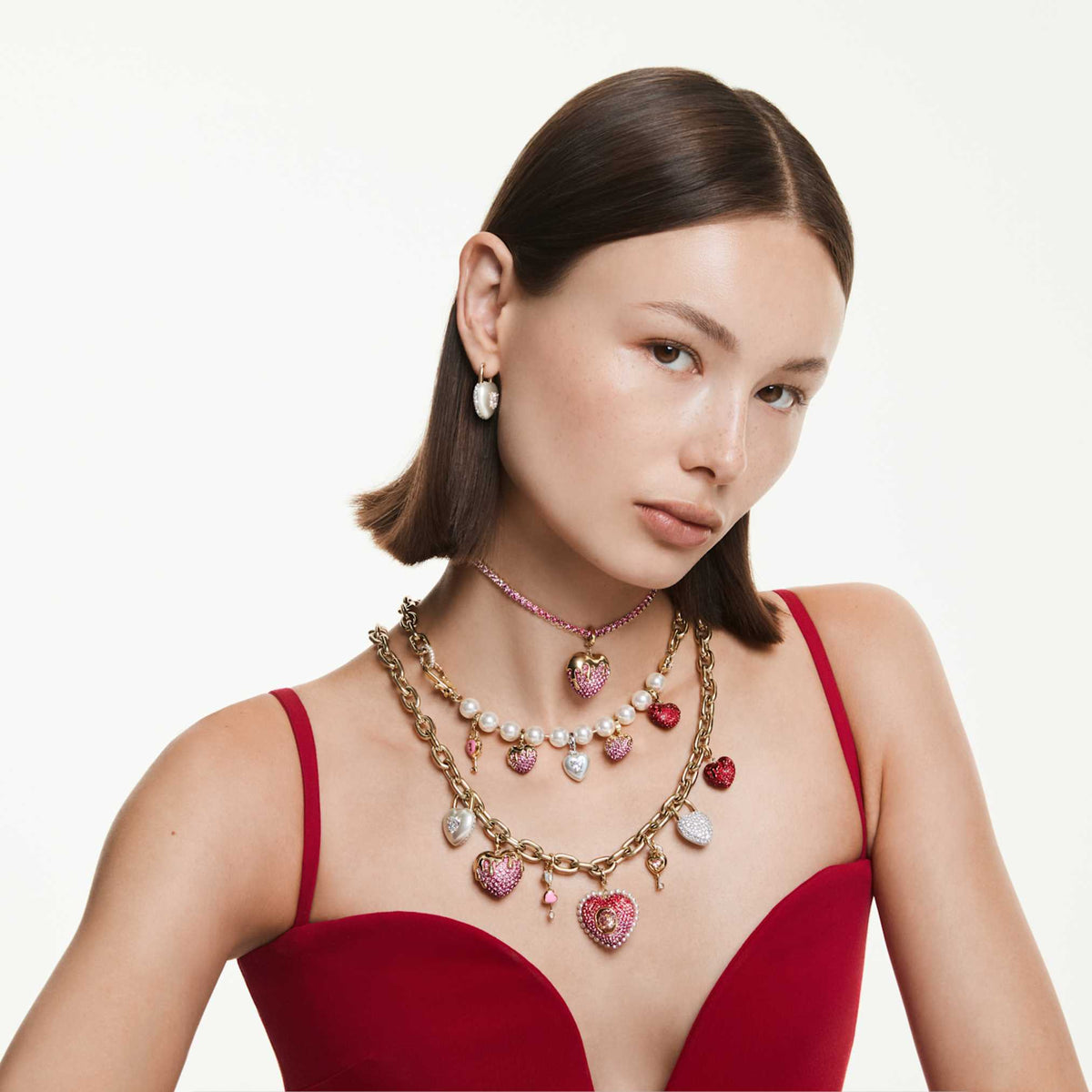 Swarovski Matrix Tennis necklace with pink round-cut accents and an 18K gold finish