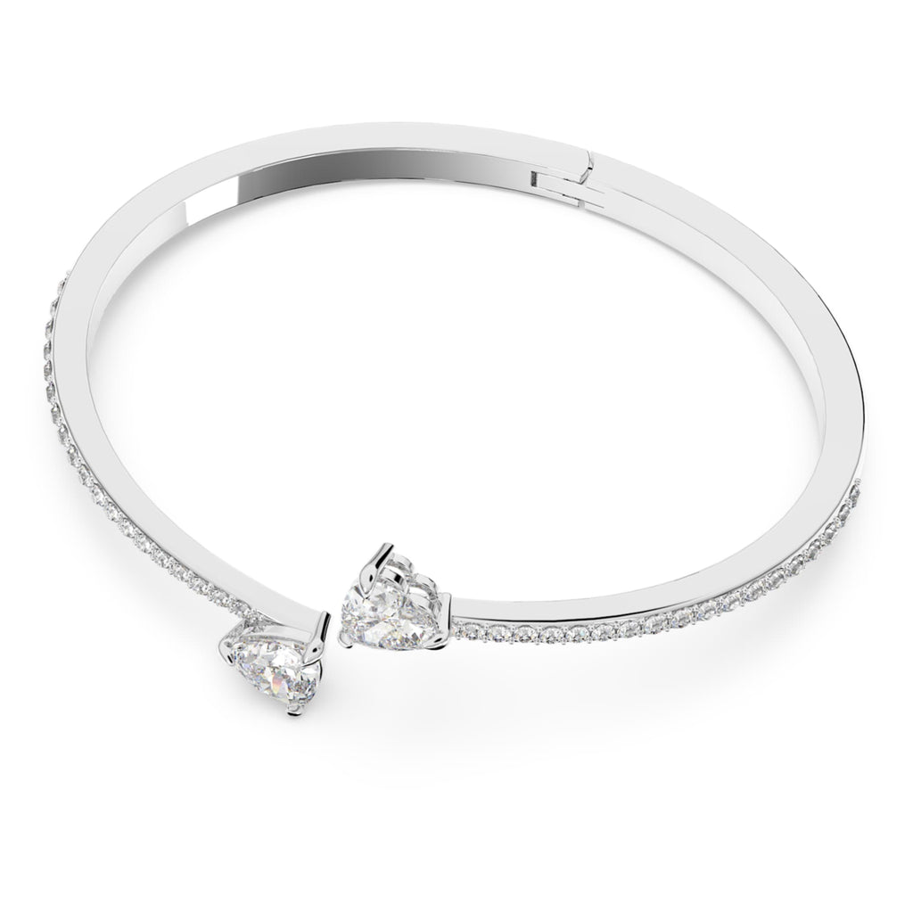 Swarovski Mesmera bangle featuring a heart motif with white accents and rhodium plating