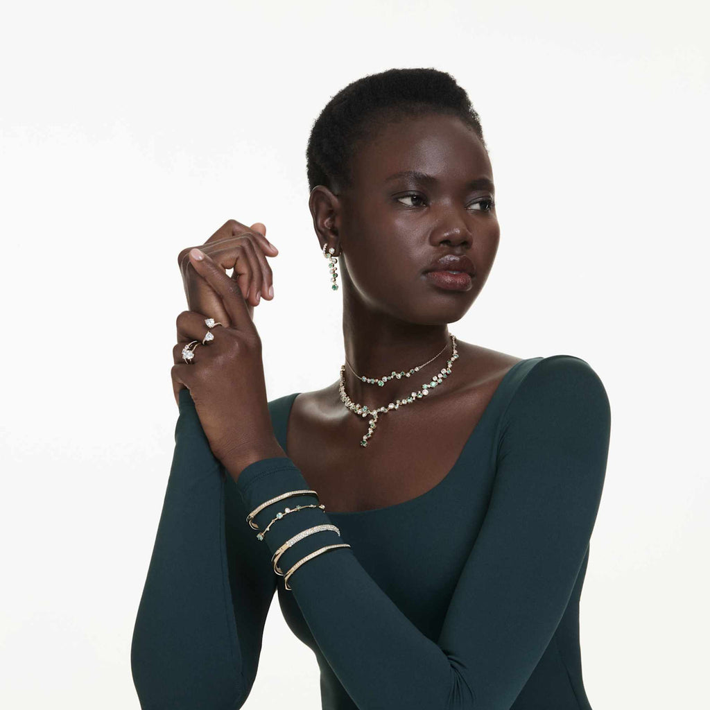 Swarovski Stilla Attract ring with white round-cut accents and an 18K gold finish