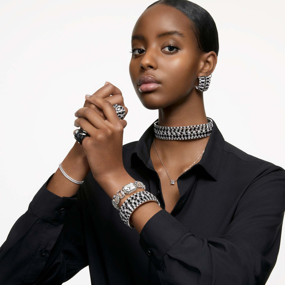 Swarovski Stilla drop earrings with white round-cut accents and rhodium plating