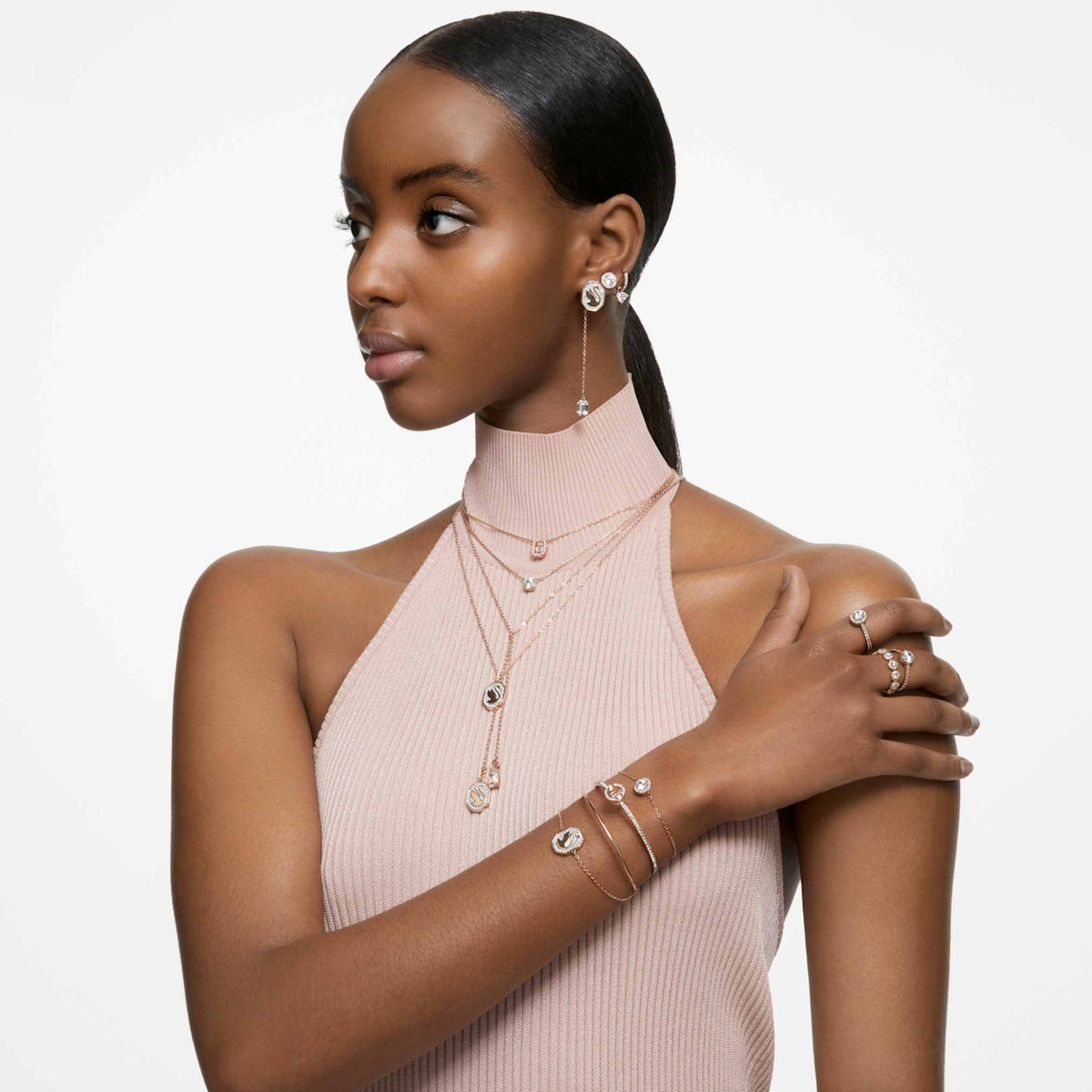 Swarovski Una Angelic stud earrings with white round-cut accents and an 18K rose gold finish